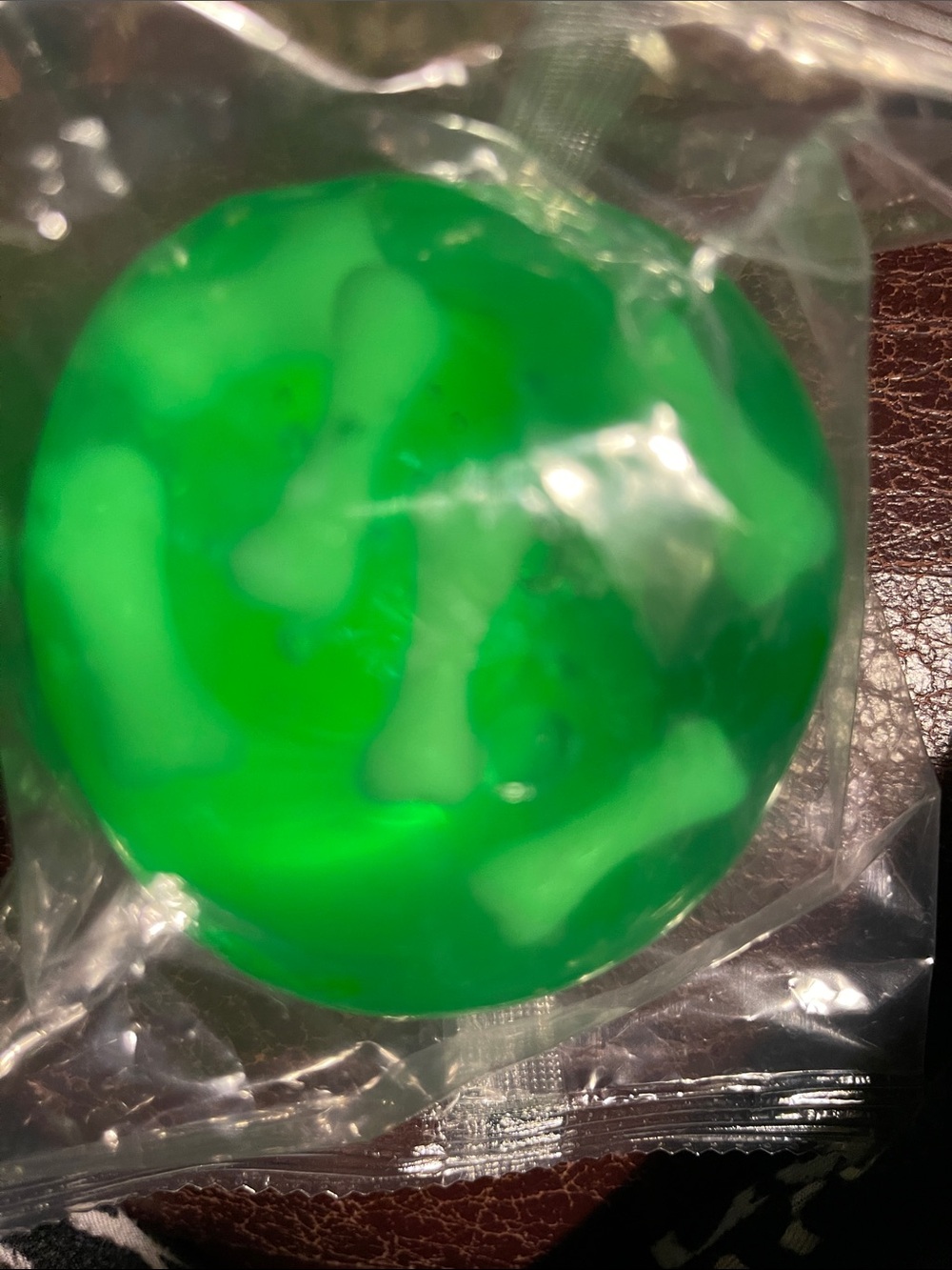 Green Squishy Toy with White Bone Accents, Halloween fun!